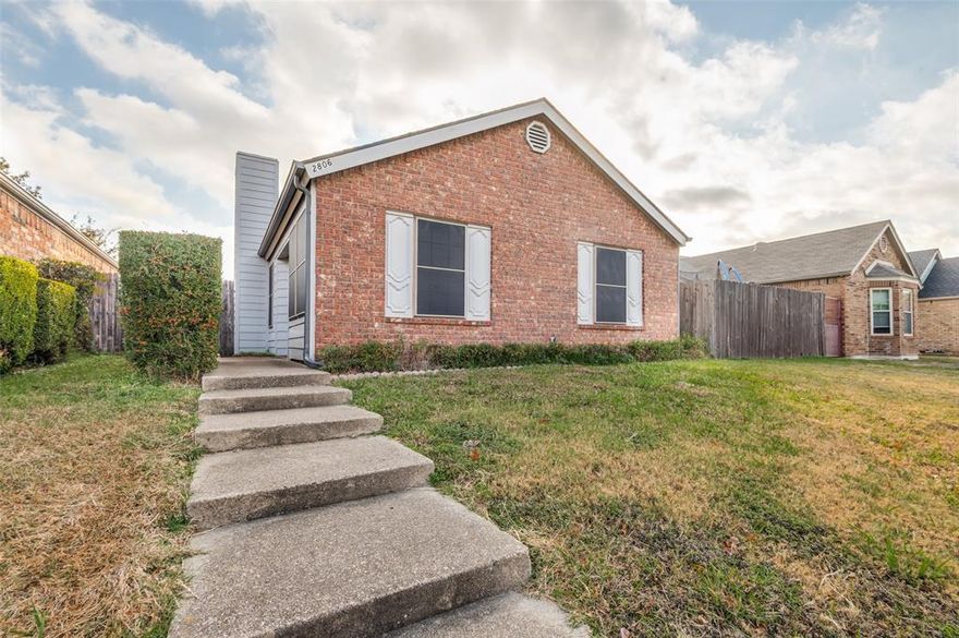 Cute as a button and easy to love.  This adorable home sits on a small, low maintenance lot, who has time for yard work.  Plus your just minutes from major highways, making your commute a breeze.  Enjoy peace of mind with updates galore, roof 2022, siding 2022, gutters 2022, exterior paint 2022,  solar screens 2022, microwave and dishwasher November 2025, interior paint and carpet November 2025.  The kitchen serves up charm with tile countertops, tile backsplash, a breakfast bar and a smooth top cooktop stove, microwave and dishwasher. The living room brings the cozy vibes with parquet flooring and a welcoming fireplace perfect for lazy evenings. Cozy, open side patio with pavers offers the ideal spot for relaxing or entertaining, and the small grassy area keeps mowing to a minimum. This little gem is move in ready and waiting for you, don't let it slip away.