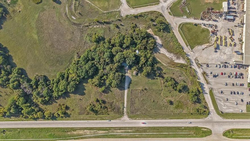 Outstanding hard-corner tract at 4002 E Hwy 380 in Wise County! Featuring 9+ acres with approximately 867 feet of prime frontage along the highly traveled US Hwy 380 and 1,167 feet of additional frontage on Trinity Rd, this property offers unmatched visibility and access. The Hwy 380 crossing creates a true hard corner, making it ideal for commercial, retail, or mixed-use development. Located outside Decatur city limits and ETJ, the land provides flexibility for a wide range of uses and can be subdivided to fit future plans. A house currently on the property makes it perfect for a buy-and-hold investment, while the site is also ready for immediate development. With its size, dual frontage, and strategic position in a rapidly growing corridor, this tract represents a rare and valuable opportunity.