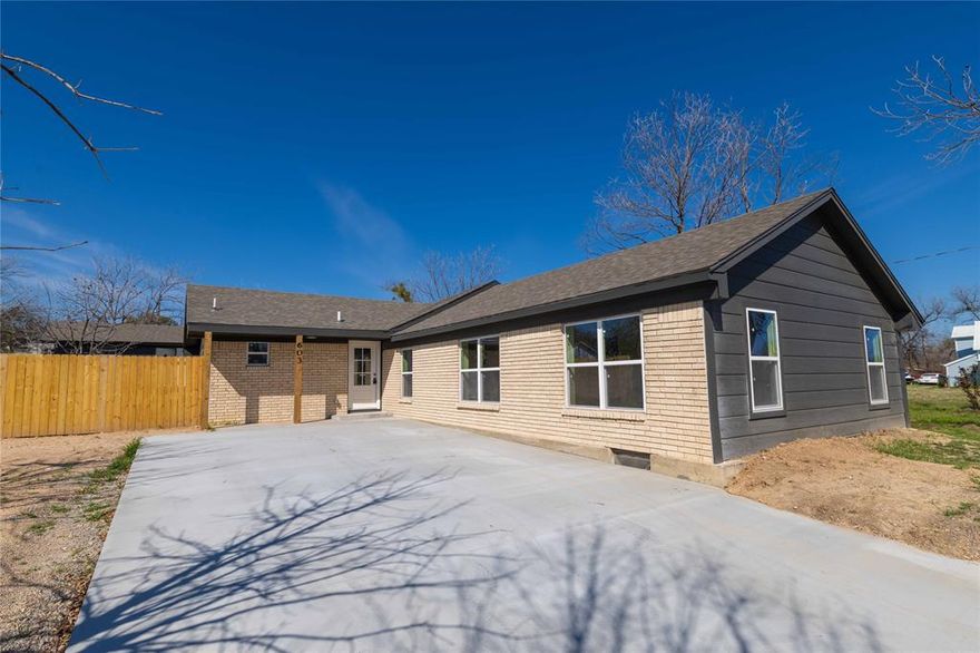 Fully remodeled 4-bedroom, 3-bath home offering 2,099 sq ft in Comanche, TX. This move-in ready property blends modern updates with warm rustic touches throughout.Step into a spacious open-concept living area featuring vaulted ceilings, recessed lighting, wide-plank flooring, and a stunning floor-to-ceiling stone fireplace that serves as the centerpiece of the home. Wood beam accents and updated fixtures add character and charm.
The kitchen boasts brand-new cabinetry, butcher block countertops, modern lighting, sleek hardware, and all new stainless steel appliances. The layout flows seamlessly into the dining and living spaces, perfect for everyday living and entertaining. This is truly a top-to-bottom renovation. Updates include all new electrical, new water and gas lines, new HVAC system, new roof, all new windows, new flooring throughout, new fixtures, and a brand-new fence and driveway. Every detail has been thoughtfully upgraded. The flexible floor plan offers four spacious bedrooms and three fully updated bathrooms, providing ample space for family, guests, or a home office. Enjoy the peace of mind of new systems and finishes while being located in an established area. Listing agent is also Property Owner