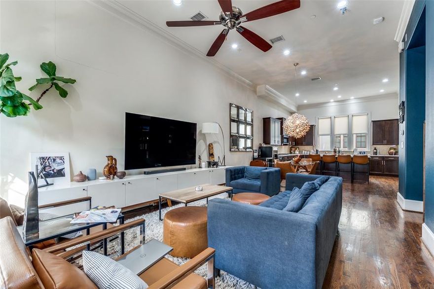 This stunning, three-level townhouse with rooftop terrace facing the skyline is located on a quiet, interior street and combines sophistication, comfort, and the best of contemporary living. For those seeking an urban experience in downtown Dallas, this is a perfect opportunity in the Intown Homes of Farmers Market. The community is beautifully maintained and perfect for strolling. The Living Room-Dining Room-Kitchen on level 2 are open, with balcony off LR. Powder room--half bath is off Living Room. Hardwood floors, 12 foot ceilings, CF. The showstopper cook's kitchen offers large island with a breakfast bar, granite countertops, stainless appliances, gas cooktop, BI microwave, tiled backsplash, & walk-in pantry. Third bedroom is on first level. All bedrooms have ensuite baths. Primary bedroom has ceiling fan.  Master bath features jetted tub, double sinks, granite vanity, large WIC. Rooftop deck looks to Dallas skyline -- room for sitting, grilling, and eating. Refrigerator, washer and dryer remain with the property. Three thermostats. Tankless water heater. Blinds, window treatments, recessed lights. Entertaining is a dream in this home, whether inside or on the rooftop deck. Two-car rear entry garage. Accessible to major freeways.