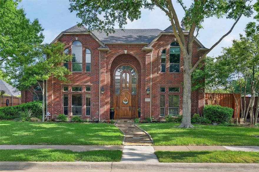 Prime location near top-rated schools, major highways, shopping, dining, and business centers complete this exceptional home.

Experience the perfect blend of elegance and comfort in the best part of West Plano. A striking solid oak and glass entry opens to a bright, airy interior with soaring ceilings and abundant natural light.

The thoughtfully designed first floor features an open layout with a spacious owner’s suite, private study, formal living area, and two fireplaces. Hardwood floors, plantation shutters, and updated lighting add warmth and sophistication throughout. The kitchen offers granite countertops, updated appliances, and a seamless flow into the breakfast area, ideal for everyday living and entertaining.

Step outside to a wraparound backyard designed for both relaxation and play. Enjoy evenings under soft lighting by the herb garden, gather in the private gated driveway, or unwind beneath mature trees surrounded by native perennial landscaping.