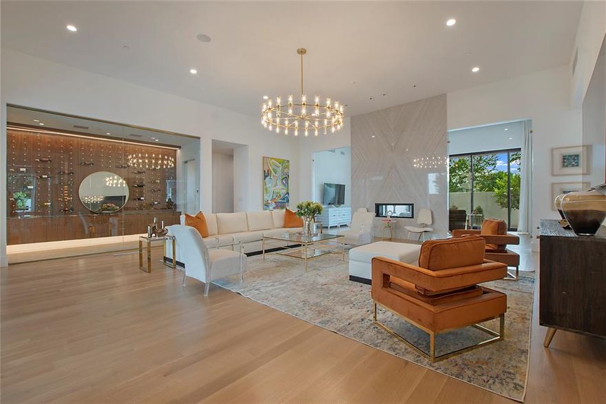 Discover a breathtaking contemporary masterpiece nestled on a private, gated .65-acre lot, designed for ultimate privacy & security. This luxurious home offers open-concept living surrounded by lush greenery, a true resort-style experience. With top-quality finishes, soaring ceilings, & 7 bedrooms—including 3 primary suites—this home is perfect for multigenerational living. Notable features include a large pool, a rooftop deck, & a 10-car garage ideal for car enthusiasts. The Poggenpohl kitchen seamlessly integrates into the open floor plan, showcasing floor-to-ceiling windows, exquisite wood accents, rare marble finishes, & custom details throughout. 1st floor boasts a primary suite with a sitting area, spacious guest suite, wine room, study, & inviting casual living areas. Kolbe metal pocket doors slide to the outdoors, enhancing the indoor-outdoor living experience. Upstairs, find 5 additional bedrooms, each with stunning custom en suite baths, game room, large media room, & deck.