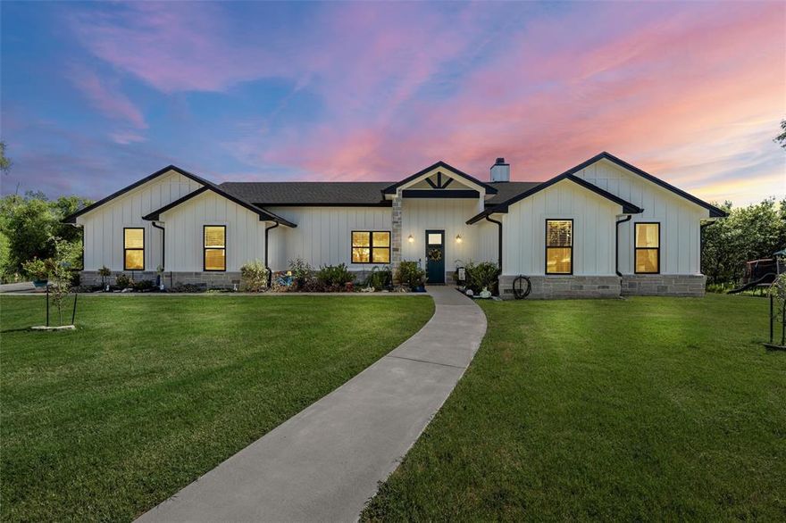 5.7 acres! Creek! Nearly-new! Tucked at the end of a quiet cul-de-sac in a growing neighborhood, this nearly-new 4 bedroom, 3.5 bath custom farmhouse offers the best of both worlds: the convenience of a neighborhood on the edge of Waco in a fantastic school district (Robinson ISD)—with all the peace and space of true country living on nearly 6 scenic acres.

The fenced pasture is perfect for a few animals, offers plenty of space to roam and play, and a walkable “beach-like” area along Flat Creek—a hidden gem right in your own backyard.

Inside, the home impresses with concrete floors, a warm stone fireplace with built-ins, and a stunning open-concept kitchen featuring double ovens, an oversized island, gigantic walk-in pantry, and a coffee bar that’s as functional as it is charming.

The primary suite is your personal retreat with double sinks, a walk-in shower, and a show-stopping soaking tub, plus a huge walk-in closet that connects directly to the laundry room, where you’ll also find a custom dog wash for your four-legged friends. A mudroom and convenient half bath are smartly placed in the main hallway for everyday ease.

A second bedroom with en-suite bath and a third with direct access to the hall bath offer flexible living options for guests or family. Don’t miss the fourth bedroom AND home office! The back porch is enormous, and the sprawling backyard is begging for a pool.

Whether you’re looking for room to grow, space for animals, or just a peaceful retreat close to town, this property delivers the country lifestyle—with modern comforts, thoughtful design, and small-town charm.