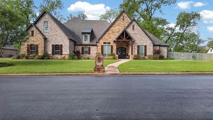 Welcome to your private East Texas Retreat in the sought after Pecan Valley Ranch community in Bullard. Nestled on a sprawling 1.17 ac lot surrounded by mature pecan trees, this stunning 5075 sf home offers the perfect blend of luxury, comfort and functionality for modern family living. This thoughtfully designed home features room for everyone- boasting 6spacious bedrooms and 5.5 bathrooms (all but 1 offer ensuite bathrooms), a dedicated office, an expansive game room with built-in bunk beds, and multiple living areas ideal for entertaining or just relaxing. The warm and inviting living room center around a beautiful gas fireplace, while high end finishes such as solid wood interior doors, granite surfaces, and designer lighting elevate the home throughout. The recently updated paint and carpet give the entire home a fresh, move-in-ready feel. The chef's kitchen featuring ice machine, double built-in frig and freezer and gas cooktop, large island and a serving bar flows seamlessly into the main living spaces creating the perfect environment for gatherings both large and small. Step outside and enjoy the peace and privacy of you acreage, complete with extra parking and a fully fenced backyard. Pet lovers will appreciate the unique dedicated dog room with its own separate dog run! Additional highlights include a oversized3 car garage and a whole house generator providing comfort and peace of mind year round. Don't miss out on this home located within the highly regarded Bullard Independent School District, offering over 1 ac lot, large fenced yard and plenty of room for your family and friends!