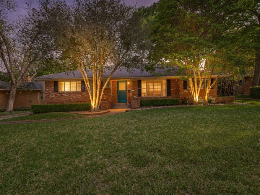 Set among the rolling hills and mature tree canopy of Oak Cliff’s historic Kiestwood neighborhood, 2816 Bonnywood Lane is a thoughtfully updated mid-century ranch that reflects the quiet charm of its surroundings. Kiestwood is known for its tree-covered streets, distinctive homes, and strong sense of place. At the center of the neighborhood is the Kiestwood Trail, a beloved route for hiking and cycling that winds through the community's rolling hills, connecting to schools and providing the perfect place to unwind or exercise. The Oak Cliff Nature Preserve, Kiest Park Conservation Area, and Kiest Park are all nearby, and the location offers convenient access across the DFW metroplex.

Fresh exterior paint and classic plantation shutters give the home a crisp, welcoming presence. Inside, gorgeous oak hardwood floors run throughout with slate in the foyer, kitchen, and laundry, bringing warmth and continuity to the interiors. The generously scaled formal living and dining rooms offer comfortable gathering spaces, while an oversized family room forms the heart of the home. Here, a handsome masonry fireplace with gas logs and hearth anchors the room, accompanied by built-in bookshelves and a dedicated desk area.

The kitchen features granite counters, a tiled backsplash, an electric glass cooktop, and double ovens. Bedrooms are well proportioned with abundant closet space, and both bathrooms remain in pristine vintage condition, finished with beautifully preserved original 1950s tile.

Outdoors, the yard is lovingly landscaped with mature trees, lawn, and thoughtful plantings. A large brick patio provides a natural setting for outdoor dining or relaxed evenings beneath the trees, partially enclosed by a six-foot board-on-board cedar fence for a private backyard. The result is a home that balances careful updates with the enduring character that makes Kiestwood one of Oak Cliff’s most admired neighborhoods.