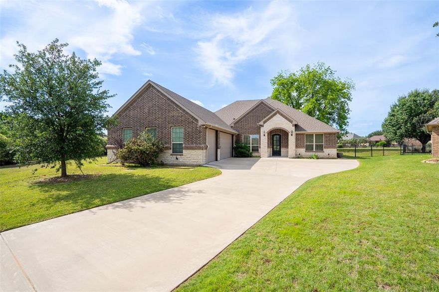 Amazing home with great floor plan at the end of a cul de sac on three quarters of an acre lot. 3 bedrooms with split bedroom arrangement. Open concept living, dining and kitchen. Master suite is a dream with huge other room attached for a den, nursery, workout room or library. Master bath has separate vanities, jetted tub and separate tile shower plus a walk in closet. Office with French doors, specialty ceiling, closet and wood floors. Island kitchen with granite countertops, 5 burner gas cooktop, walk in pantry, wood floors, subway tiled backsplash and stainless steel appliances. Metal fence with no dig underpinning. Custom blinds throughout. Huge back porch with electric sunshades. Crown moldings, incased windows, framed mirrors, iron front door, gas log fireplace. Full 3 car garage with tool chest cabinets and epoxy floor. Community pool, clubhouse and gated entry.