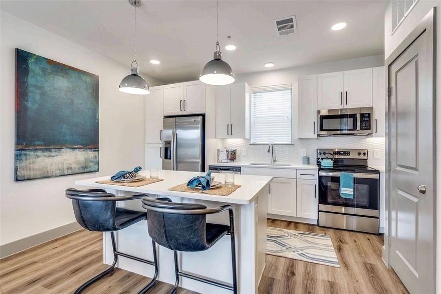 This stylish townhome features modern finishes, a two-car garage, and an open layout. Up the first set of stairs you'll find the kitchen, living area and half bath. The kitchen has stainless steel appliances, sleek white countertops, and an island perfect for meal prep or dining. Natural light pours through the large windows that open up to a balcony. Ascending to the third floor, you'll find a landing space perfect for a home office and the laundry closet. The oversized bedroom features a second balcony, a sitting area, an ensuite bath and walk in closet. This townhome offers easy access to shopping, dining, & entertainment. Amenities include an gorgeous infinity edge pool, gym with the latest equipment, grilling stations, fire pit, co-working space, lake with jogging path and two dog parks. MARKET RENT IS $2299. 6 WEEKS FREE GIVEN UPFRONT ON 12+ MO LEASE. NET EFFECTIVE RENT ADVERTISED.