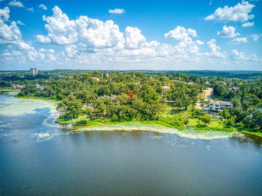 Rare opportunity to own a direct waterfront lot on Bellwood Lake in the prestigious Cascades community. Nestled in an upscale, golf course community, this wooded lakefront lot offers a rare blend of natural beauty and refined living. The lot is generously sized, with ample space to build a custom home that takes full advantage of both the water frontage and the surrounding forested landscape. Utilities—water, sewer, and underground electricity—are already in place, and the subdivision features paved roads, manicured common areas, and thoughtful architectural guidelines to protect long-term property values. Residents enjoy access to exclusive amenities, including a clubhouse, tennis courts, and walking trails, all set within a secure and well-maintained community. Whether you're envisioning a serene weekend retreat or a year-round residence, this lot offers the perfect canvas for luxury lakefront living.