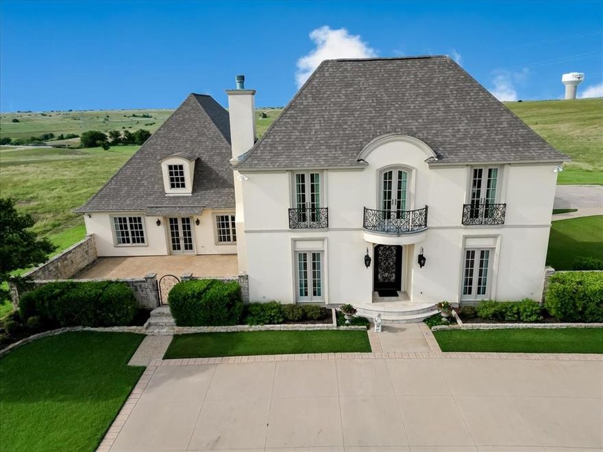 Perched on 10 pristine acres with panoramic 360° views, this breathtaking estate is the pinnacle of luxury living in the Texas countryside. From the moment you arrive, you'll be captivated by the unmatched scenery, refined elegance, and seamless indoor-outdoor flow. Step through the dramatic entryway, where a barrel roll ceiling adorned with mosaic tile sets the tone for the artistry and craftsmanship found throughout the home. Inside, the open-concept gourmet kitchen—complete with top-tier appliances—flows effortlessly into a cozy, inviting den, perfect for relaxed evenings or entertaining guests.  The formal dining room, graced with an exquisite chandelier, elevates every meal, while the butler’s pantry offers a seamless connection from kitchen to dining—blending function with style. A spacious game room with hand-selected Persian carpeting invites hours of enjoyment, and the media room provides the perfect escape for movie nights or weekend sports marathons. Double doors lead to a resort-style lanai and covered loggia, overlooking your private, sparkling pool—an ideal setting for Texas sunsets and starlit gatherings. When it’s time to unwind, retreat to the luxurious master suite, featuring elegant Persian carpeting, a spa-inspired ensuite bath, and peaceful views. Three additional oversized bedrooms provide ample comfort for family and guests—bringing the total to 4 spacious bedrooms and 4.5 luxurious baths.

? This is more than a home—it’s a masterpiece of elevated living. Schedule your private showing today and discover the pinnacle of Parker County luxury. ?