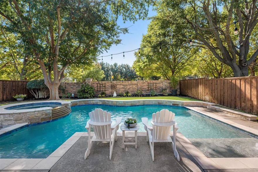 Beautifully updated home in the highly desirable Wellington community of Flower Mound. This move-in-ready property offers a spacious open-concept layout with 4 bedrooms, 2.5 baths, a dedicated study, and a large game room. Inside, the home feels bright and refreshed with light oak wood floors, fresh interior paint, upgraded baseboards, smart window shades, and new premium soft-cushion carpet upstairs. The first-floor primary suite overlooks the backyard and includes a beautifully updated bath with dual vanities, a frameless shower, a freestanding soaking tub, and quartz countertops. Upstairs offers three generous bedrooms with walk-in closets and a spacious game room. Step outside to a true resort-style backyard. Mature trees surround the space, creating natural privacy for the heated pool, relaxing spa, upgraded St. Augustine grass, and finished landscaping. A large covered pergola anchors the outdoor kitchen with a built-in grill and space for additional appliances. A generous green play area makes the backyard both beautiful and functional—ideal for entertaining, relaxing, and enjoying quiet evenings at home. Additional updates include both AC units replaced, gutter guards, a gas stove, insulated garage doors, epoxy garage flooring, and a kitchen backsplash.The Wellington community offers an unbeatable lifestyle with top-rated LISD schools, multiple pools, pickleball and basketball courts, walking trails, a fitness center, clubhouse, parks, and playgrounds—all with convenient access to shopping, dining, and major highways. This home combines comfort, upgrades, and location—making it easy to love and even easier to live in.