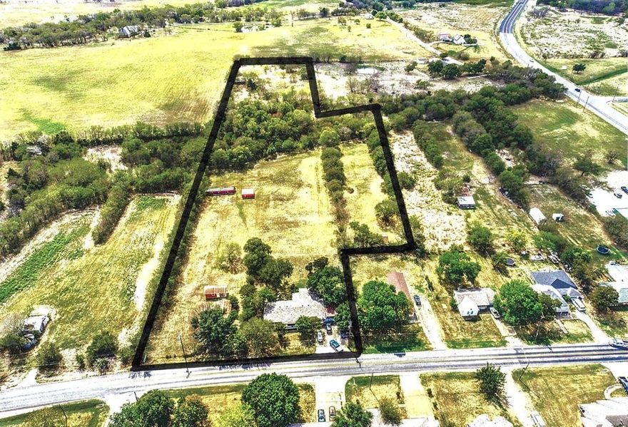 Ask listing agent for comps!! 7.26 Acres in city limits of Gunter with apprx 2300 SF house that needs updates but could be used for rental or office and had roof replaced in 2022.  Great development or investment property near Preston Rd and part of Downtown Master Plan! This property is located on Main Street aka FM 121 just east of Preston Rd. Seller financing available with 50% down for 3 years. Zoning info per City of Gunter is: “Currently zoned THOR(Thoroughfare District) in the front portion and SF1 for remainder. The THOR is an overlay district, that is a base zoning of C-1. Anything with Main Street frontage was re-zoned as THOR in our future land use plan. Currently, this property can be used as SF1, but if the home becomes vacant for a period of 6 months or more or is demolished, the land use would then change to the C-1 zoning on front of the parcel”. Taxes paid by seller last year were $7700. Please note that property goes well beyond the creek to the south boundary. City water and sewer!! Small yellow building to the east of home is part of property and currently used for storage. ADDITIONAL LAND AVAILABLE!

Gunter is poised for growth with its location just north of Prosper & Celina and south of Sherman as well as its proximity to future extension of the Dallas North Tollway.  Plans for Universal Theme Park in Frisco 20 minutes from property and HEB, Costco, & Lowe's in Celina 10 minutes away.