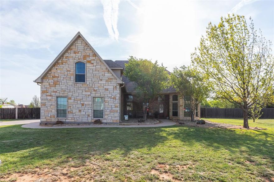 Step into this spacious and versatile home, thoughtfully designed for comfort, functionality, and entertaining—peacefully located outside the city limits. Featuring 4 generously sized bedrooms, this layout offers both privacy and convenience—including a bedroom with direct access to a bathroom downstairs, perfect for guests or multigenerational living. In addition, a room downstairs offers flexibility to be used as a bedroom or a home office to fit your needs.
At the heart of the home, the large kitchen serves as the true centerpiece, featuring a generous island perfect for casual dining or breakfast gatherings, along with stainless steel appliances, including a refrigerator. The open-concept design flows seamlessly into the dining room and living room, creating an ideal space for entertaining family and friends.
The main living area is warm and inviting, centered around a fireplace that adds charm and comfort. 
Upstairs, you’ll find a 5th bedroom that is a large private space with its own full bathroom and closet—ideal for a guest suite, game room, media room, or anything the buyer envisions. The possibilities are endless to fit your lifestyle.
The large primary suite is a true retreat, complete with its own cozy fireplace, creating the perfect space to unwind at the end of the day. The primary bathroom adds to the luxury with a well-designed layout featuring a large soaking tub, a spacious walk-in shower, and a dedicated makeup vanity area—offering both style and everyday convenience.
Step outside to enjoy a large backyard designed for relaxation and entertaining. In addition to the covered patio with a third fireplace, the outdoor space also features an outdoor kitchen complete with a grill and sink, a garden, chicken coop and tunnel, and a storage shed—perfect for those who love outdoor living, gardening, or hobby farming.
This home offers the perfect blend of space, flexibility, and cozy touches—ready to fit your needs and create lasting memories.