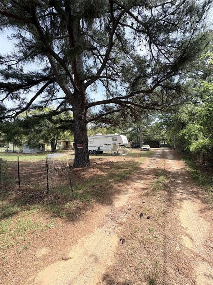 Rare opportunity to own a unique multi-structure property on 1.2 unrestricted acres in a private, peaceful setting. This versatile property offers multiple living spaces, separate electric meters, and flexible use potential—ideal for multi-generational living, rental opportunities, or a homestead lifestyle.

The property features a main residence, an additional smaller home, and RV accommodations, along with a shop or garage and carport for added functionality. The long private drive enhances privacy while still offering convenient access to surrounding areas.

With no deed restrictions, this property provides endless possibilities for buyers looking for flexibility, income potential, or room to grow.

Please note: Do not park on grass. All vehicles must use the driveway only.

Buyer to verify all information, utilities, and potential uses.