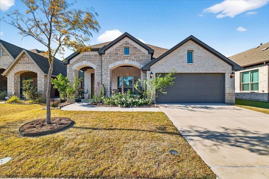2023 built one story Bloomfield home in Willow Wood with 3 bedrooms, 2 bathrooms, and front office with French doors. Open kitchen, dining, and living layout with multiple rear facing windows providing natural light across main living areas. Engineered wood flooring in entry, office, kitchen, dining, and living areas. Kitchen includes island, cabinetry upgrades, pantry, and dining area open to living space. Primary bedroom includes sitting area, larger windows, and ensuite bath with separate vanities, tub, and shower. Secondary bedrooms are positioned separately from primary suite. Backyard includes brick rear wall, lawn area, patio space, and established magnolia, live oak, and Chinese pistache trees. Community amenities include pool, parks, trails, and common areas.