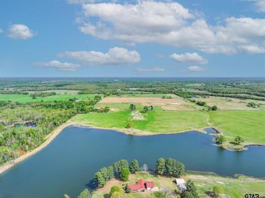 Stunning waterfront acreage in one of the county’s most beautiful new rural developments. Tract 1 features 15.71 acres directly on a fully stocked private lake,  perfect for fishing, canoeing, or paddle boarding. A pipe gate entrance is already in place, and utilities are confirmed with Wood County Electric and Pruitt Sandflat Water. Open pastureland with hay production and ag exemption in place makes this a practical and beautiful spot for your dream home, ranch, or weekend retreat.