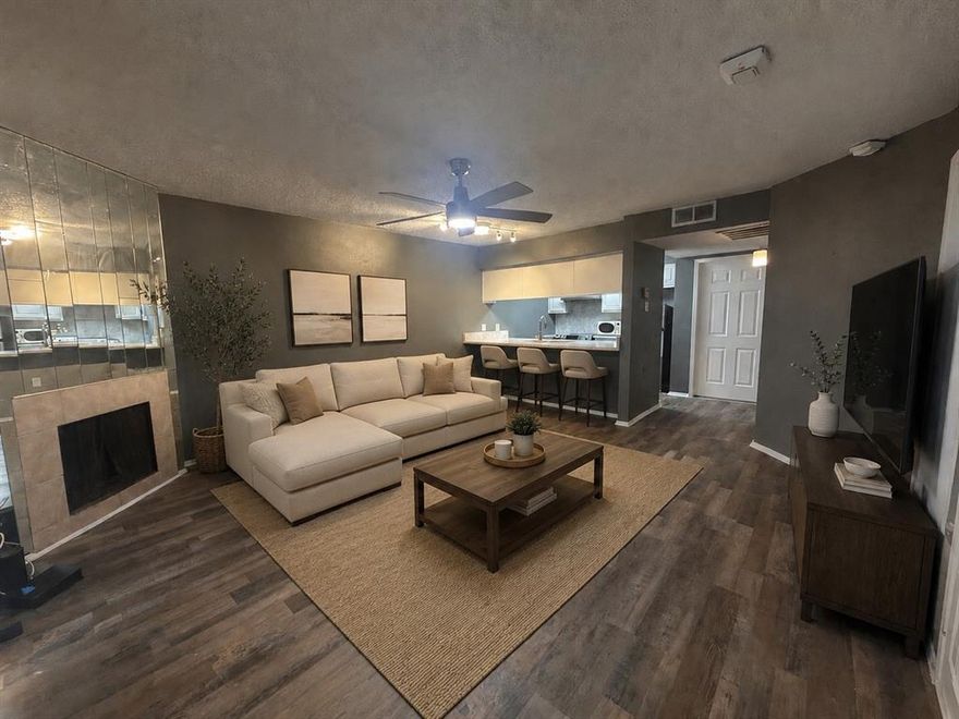 Move in ready condo located in Richardson ISD! This first floor 1 bedroom, 1 bath features laminate wood flooring throughout the living, dining, kitchen, and bedroom areas. The kitchen has bar seating that opens to the main living area with a cozy fireplace. The bedroom includes a spacious walk-in closet with plenty of hanging space. Additionally, the condo is equipped with electric central air and heat, LED mirror lighting, a utility closet that comes with a full-sized washer and dryer and enjoy the covered screened patio.  Community amenities include a pool, tennis courts and dog park. Easy access to Hwy 635 and US-75. Ideal for first time buyers, downsizers, or investors seeking a turnkey property.