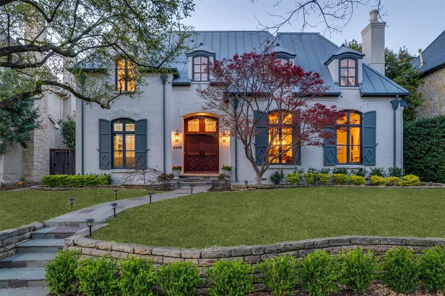 This elegant updated traditional home with ELEVATOR is designed by renowned architect Stephen Chambers, and is located in the sought after Highland Park neighborhood within the prestigious HPISD. Blending classic charm with modern convenience, the home boasts numerous recent upgrades, including completely updated bathrooms and refinished wood floors for a fresh, sophisticated look. The downstairs offers a beautiful study or optional fifth bedroom with built ins and a full bath, two living areas with fireplaces, one with a beautiful vaulted ceiling, two dining areas, kitchen, and a powder bath. The home features beautiful masonry and woodwork throughout adding a dramatic flair to the spaces. The kitchen itself is a chef’s dream, featuring a Wolf gas cooktop, a new Bosch dishwasher, and double GE ovens, while the adjacent laundry room leads to a butler’s pantry and wet bar-perfect for entertaining. The charming side patio off the kitchen is equipped with a gas hookup for easy outdoor grilling. A grand staircase and refurbished elevator provide seamless access to the second floor, where the spacious primary suite includes a coffee bar, fireplace and elevator access for ultimate comfort. The luxurious primary bath features dual sinks, a freestanding tub, a spacious shower, two large walk in closets, and a balcony, creating a true retreat in this stunning Highland Park home. A fourth bedroom or game room with new carpet provides an ideal space for guests or additional living. Home has ample storage and a stairwell to attic storage. The two car garage is enhanced with sleek epoxy flooring and storage. The front yard features a new irrigation system for effortless landscaping, while the backyard offers a heated pool and spa for year-round enjoyment. Additional upgrades include a new hot water heater for improved efficiency and two new Bryant HVACs service two of four zones. Easy walk to Armstrong Elementary, MIS, HPMS, SMU, Snider Plaza, Katy Trail, and Knox-Henderson.