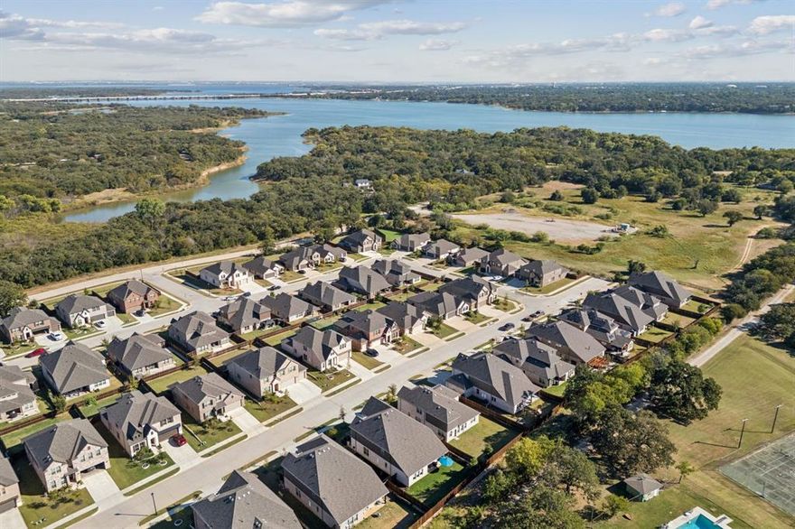 Beautiful Blackburn floor plan by Beazer in Sycamore Cove, a 97-home lakeside community just half a mile from Lake Lewisville and gated Sycamore Bend Park! This spacious home offers 4 bedrooms, study, loft, and media room with open gathering spaces and private retreats filled with natural light.
The chef’s kitchen features quartz countertops, gas cooktop, oversized walk-in pantry, and bar seating that flows seamlessly into the family room. Enjoy evenings on the inviting front porch with peaceful eastern exposure, or retreat to the private backyard with ample grassy areas for pets and kids to play. Additional highlights include an oversized garage with tall ceilings for storage and a large walk-in attic - no ladder to climb. Located in the charming town of Hickory Creek, residents enjoy an extremely low 1.661 tax rate with no MUD or PID taxes. Walk to Lake Lewisville and Sycamore Bend Park with boat launch, pavilion, tent camping, paddle board and canoe rentals. Experience the perfect blend of comfort and lake life living!