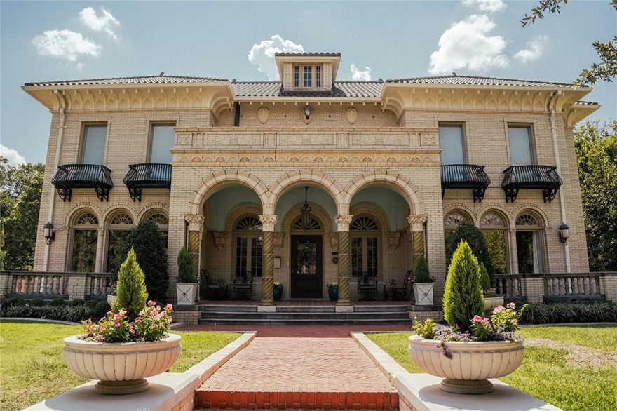 Welcome to The Dulaney House! An Italianate treasure standing proudly at the east end of Elizabeth Boulevard in the heart of Ryan Place.
Spanning 5,753 square feet, this historic residence offers a rare blend of timeless character, architectural beauty, and modern comfort. From the moment you arrive, sculptural arches and the distinctive green terra cotta detailing set the tone for the elegance that unfolds within.
Inside, the marble-floored entry and hand-painted trompe l’oeil ceiling create a grand first impression, opening into a stunning living room anchored by a hand carved stone fireplace. The home features five spacious bedrooms, three full baths, two half baths, and two plush living areas—each space thoughtfully enhanced to preserve the home’s historic charm while supporting today’s lifestyle.
An additional 784 square feet of finished basement space provides flexible living options ideal for a game room, home gym, or private entertaining retreat.
Step outside to a backyard setting that feels truly cinematic. Enjoy a covered patio, stand-alone pavilion, and a sparkling pool with cascading waterfalls—all designed for memorable gatherings and quiet evenings alike.
Just beyond the pool, a beautifully finished 702-square-foot guest house offers its own living room, bedroom, eat-in kitchen, laundry, and private patio overlooking the water—perfect for guests, multi-generational living, or a secluded workspace.
Admired for generations and featured in designer tours and publications, The Dulany House presents a rare opportunity to own one of Fort Worth’s most iconic historic homes.