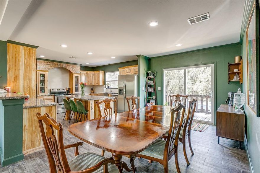 Escape to your own private retreat on 13.8 secluded acres in picturesque Millsap! Built in December 2022, this modern manufactured home blends peaceful country living with stylish comfort. The home is nestled among mature trees at the end of a winding drive, offering unmatched privacy and serene natural views. Step inside to discover an open-concept layout filled with natural light, featuring a spacious living area surrounded by windows that overlook the wooded landscape. The gourmet kitchen boasts custom natural-wood cabinetry, a large island, and ample storage, making it the perfect centerpiece for family gatherings or entertaining guests.

The split-bedroom floor plan provides a private primary suite and three comfortable guest rooms, ensuring space and functionality for all. Outside, a mowed walking trail encircles the property—ideal for nature walks, ATV rides, or simply enjoying the peaceful scenery. The small pond creates a tranquil focal point, attracting wildlife and adding to the property’s charm. You’ll also find multiple cleared areas ready for gardening, outdoor seating, or future improvements, while heavily treed portions provide shade, privacy, and a true East Texas forest feel.

Whether you’re looking for a weekend getaway, homestead, or full-time residence, this property offers endless possibilities. Imagine evenings by the fire pit beneath the oaks, and starlit nights free from city lights. With its blend of comfort, acreage, and seclusion, 5878 Greenwood Rd delivers the perfect balance of modern living and rustic tranquility—just a short drive from Weatherford, Mineral Wells, and Fort Worth.