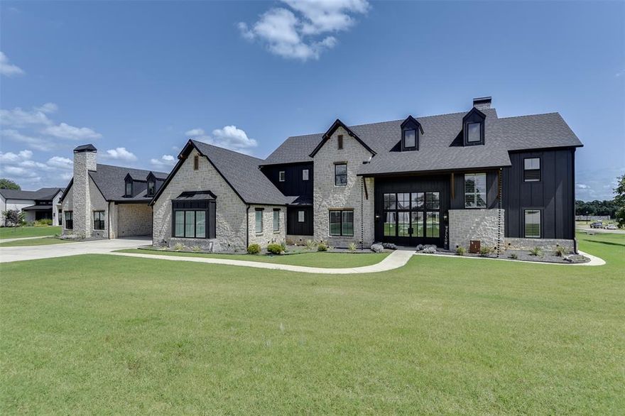 Experience the ultimate in luxury and entertainment on 2.5 beautifully maintained acres with this 5,000 sq ft estate, thoughtfully designed to offer elegant living, everyday comfort, and resort-style amenities. The main residence features an open-concept layout with high-end finishes, a chef-inspired kitchen, whole-home sound system (including the back porch and pool area), a dedicated dog wash station, and a spa-like primary suite with a steam shower and air jet soaking tub. A private 1-bed 1-bath guest quarters includes a full kitchen and living room, ideal for visitors, multigenerational living, or a home office. The 2,500 sq ft climate-controlled shop is an entertainer’s dream, complete with a custom pool room and bar, bunk room, full bathroom, massive 150 inch projector screen with immersive surround sound, and an RV hookup for added flexibility. Outside, enjoy a stunning resort-style pool with a dramatic firewall feature, a gourmet outdoor kitchen with built-in grill, flat top, large burner, sink and cooler, an expansive covered patio with integrated sound and the option to be fully screened in, a multi-use sport court for basketball or pickleball, and your very own putting green. Professionally landscaped with lighting and irrigation, this rare property offers an unparalleled lifestyle with features seldom found together in one extraordinary package.