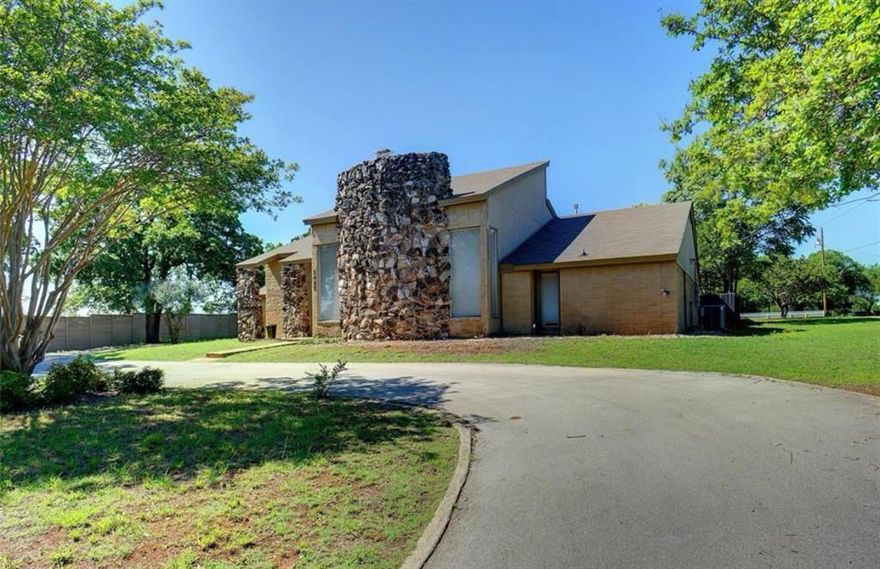 Amazing opportunity in the heart of Southlake! Located among multi-million dollar estates, this spacious lot offers the freedom to bring your own builder and create your dream custom home—no HOA! Existing 1970s home offers vintage charm with a sunken living area, large stone fireplace, and polished concrete & tile flooring. Features include 2 Beds, 2 Full Baths, 2-Car Garage, multiple living & dining areas, and an open floorplan. Kitchen boasts white cabinetry, new stainless steel appliances including built-in microwave, oven, and dishwasher, and opens to a sun-filled breakfast area. Split bedroom layout with a large primary suite featuring garden tub, separate shower, dual vanity & walk-in closet. Huge fenced backyard with mature trees, circular driveway, and plenty of space for entertaining or expansion. Easy access to Hwy 114, Southlake Blvd & just minutes to dining, shopping, and entertainment. Carroll ISD. Don’t miss this rare find in one of Southlake’s most desirable locations!