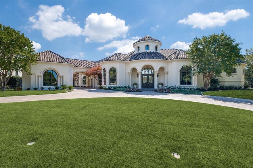 Encounter luxury living on one of Starwood's most esteemed streets. This 1-story spans 7,320 SF on an impressive 1.25-acres. Indulge in the sophisticated office with 2-story ceilings and extensive woodwork. The gameroom with coffered ceilings and an exquisite fireplace (1 of 5) is near the bar and temp-controlled wine cellar. Retreat to the award-winning pool and spa. The lush woods and walking trail provide a serene backdrop in the heart of Frisco. Discover tranquility and functionality in this lovely home. The spacious utilitarian kitchen has tall ceilings and top of the line amenities including a gas stove, 2 dishwashers, a warmer and double ovens. Adjacent to the kitchen, find a substantial butler's pantry with ample storage for the culinary enthusiast. Each bedroom offers an ensuite bathroom. The master opens to a haven of peaceful trees, patios and water features.