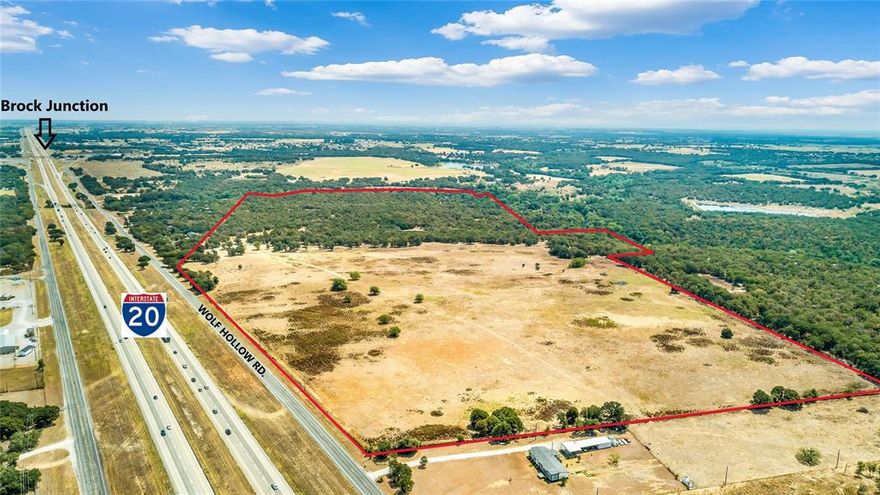 This 146.78-acre property provides hunting in the wooded area, fishing, coastal patches, cattle grazing & fronts Grindstone Creek. 1465 feet of I-20 frontage is ideal for a commercial business, resale or leasing potential. Just 11 miles west of Weatherford, Wolf Hollow serves as a feeder for I-20 & provides both east and westbound lanes for easy access. The 3-bedroom, 2-bathroom home features kitchen appliances, hardwoods, soft-close cabinets and drawers, marble countertops, tile backsplash, new electric panel, and a newly built master bedroom suite with master bathroom - which were all installed just about 5 years ago. The large carport provides shade and protection for multiple vehicles, and the fenced yard around the house keeps most pets close to home. Another plus, access to public water. The boundary lines indicated on the photos are for general information and are not exact.