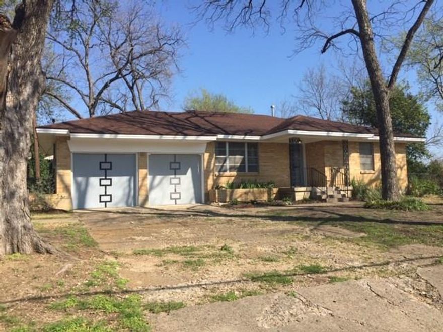 Cute brick home on over-sized corner lot. Hardwood floors in living, dining, hallway and bedrooms. Spacious kitchen with center island with butcher block counter top. Decorative lighting over island and recessed canned lighting illuminating concrete counter tops with subway tile backsplash. Appliances include refrigerator with ice maker, gas range, dishwasher and disposal. Formal dining room with sliding barn door from kitchen. Master suite with walk-in closet and master bath with a walk-in shower. Additional parking on side circular driveway. Front-entry garage with 2 separate doors & 1 remote. Lawn has sprinkler system.