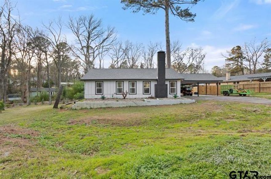 Welcome to this adorable, move-in-ready home on a large lot in Hideaway Lake. This charming 3-bedroom, 2-bath home offers an attached carport and an expansive yard featuring a new wood fence and the recent clearing of several trees. Inside, you’ll find an updated kitchen with quartz countertops, tile backsplash, and modern cabinetry that opens to a spacious dining area and cozy living room with an updated tiled wood-burning fireplace. The home includes two generously sized bathrooms, ample closet space, vinyl plank flooring, carpeted bedrooms, and a covered back deck ideal for relaxing or entertaining. The master bath features dual sinks and a walk in shower. Amenities in Hideaway Lake include a golf course with 27 holes of golf, pickleball courts, tennis courts, community pools, 3 lakes, guarded, restricted access, clubhouse, marina, and much more! Don't miss this great opportunity in the gated community of Hideaway Lake!