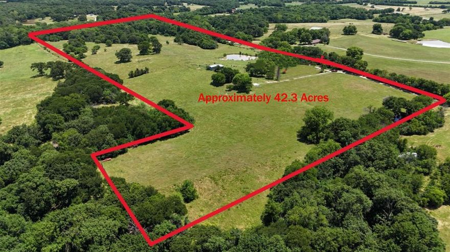 Are you searching for a tranquil and picturesque property that truly offers the best of both worlds. Conveniently located just off Hwy. 69 and set down a private road, this stunning 42.3-acre parcel is nestled halfway between Denison and Bells, within the highly rated Bells ISD. The land itself is a scenic masterpiece, featuring rolling hills, majestic oak and pecan trees scattered throughout, and a beautiful, tree-filled creek bottom that attracts a variety of wildlife—perfect for outdoor enthusiasts, especially those who enjoy spotting deer. Whether you are seeking a peaceful weekend getaway or a place to live while you build your dream home, this property delivers. The move-in ready 2-bedroom, 2-bath mobile home was completely renovated down to the studs in 2024 and now boasts foam insulation in the walls and a modern mini-split system for efficient heating and cooling.
What makes this property even more appealing is the functioning deep well that supplies drinking water to the home, which could also serve for garden irrigation or livestock needs. The land is fully fenced and cross-fenced, offering abundant pastureland with mixed loam soil—ideal for horses or other livestock. In addition, there’s a barn and two stock tanks, one is in great shape, ready for your animals. You’ll love the blend of seclusion and convenience, as the property is close to Sherman and Denison while still providing the peaceful privacy of country living. With multiple scenic building sites available, this is a hidden gem waiting to be discovered, all the while in the very popular Bells ISD. If you’re interested in learning more or would like to schedule a visit, contact me or your favorite realtor today. I’m confident you’ll fall in love with this unique property!