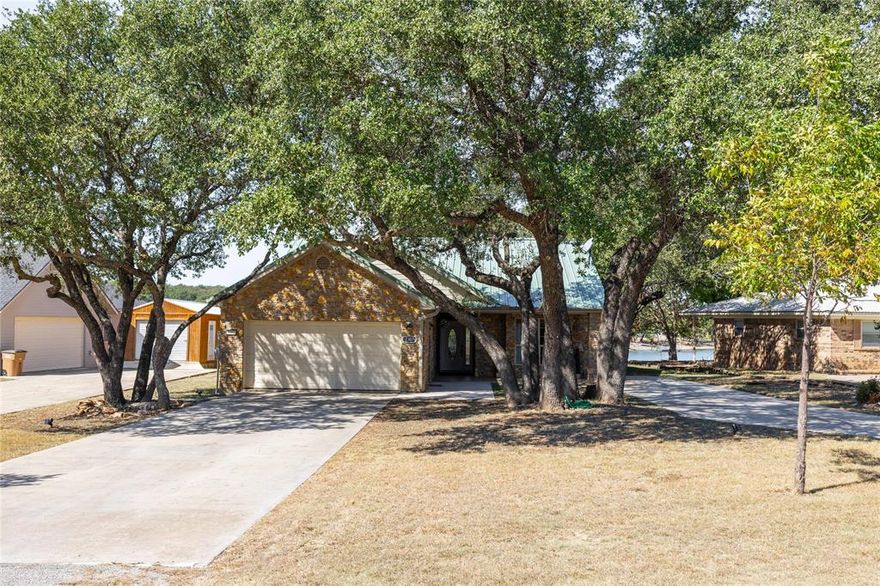 Now this is the perfect lakefront retreat in one of the most desirable neighborhoods on Lake Brownwood! Whether you're looking for a peaceful vacation getaway or your forever home, this property offers the best of both world. Enjoy beautiful lake views from the spacious covered back patio, expanses deck and Inside the entire back end of home is lake views in every area! The interior features fresh paint and new flooring throughout. A thoughtfully designed open concept layout and 2 large sitting areas are perfect for entertaining friends. Sit outside to relax with your morning coffee or unwind with an evening glass of wine while watching the wildlife and taking in the tranquil lake scenery. This lakefront gem also includes a private dock with a boat lift and access to an incredible list of neighborhood amenities. To list a few- Golf, fishing, lodging, RV spots, pickleball and basketball courts, a restaurant, pool, playgrounds, gardening, fitness center and much more! This charming home is move in ready and waiting for its new owners. Don't miss your chance to make lake living in a resort neighborhood your everyday realty!