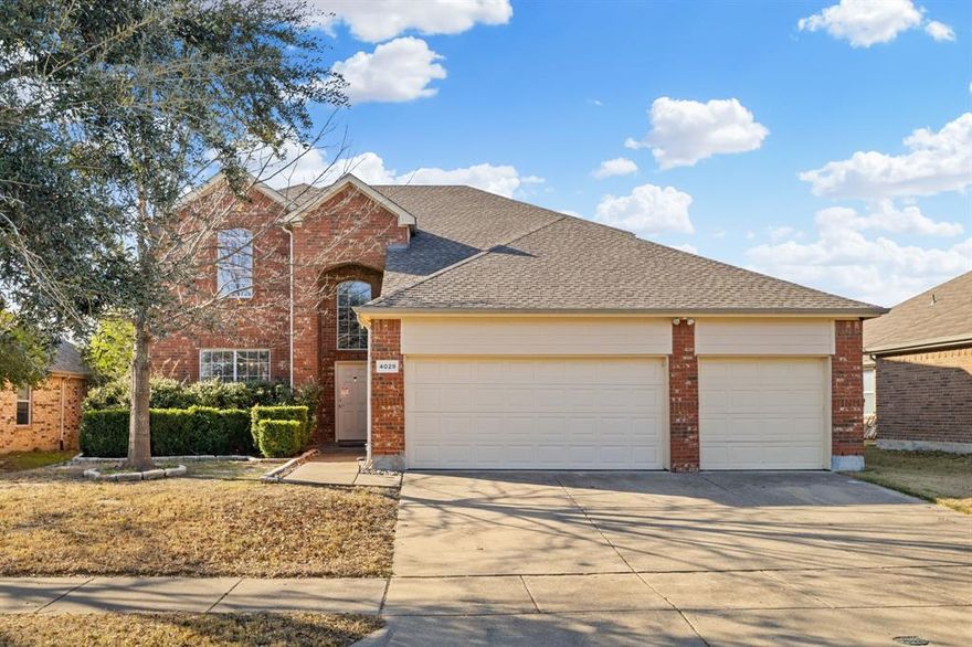 **Ask about the 2.75% Assumable Rate!** Welcome home to this spacious and thoughtfully updated two-story, 4-bedroom, 2.5-bath home with a 3-car garage, located in the heart of Heartland. Recent upgrades add both style and function, including rich wood floors and 8-inch baseboards on the first floor, enhanced laundry room shelving with added electrical, and a covered patio with tile—perfect for everyday living and entertaining. (A full list of updates is available in Transaction Desk.) The open-concept kitchen, breakfast area, and living room create a warm and inviting gathering space, while the separate formal dining room at the front of the home offers flexibility as a home office or additional living area. The beautifully updated kitchen features stunning leathered granite countertops, dual ovens, and cabinetry with convenient pull-out drawers—designed to make both cooking and hosting a joy. The primary suite is tucked away on the first floor, offering privacy and comfort with an ensuite bath and walk-in closet.  A convenient half bath completes the first floor. Upstairs, you’ll find three generously sized secondary bedrooms, a full bath, and a spacious game room with walk-out access to floored attic storage—an added bonus for organization and hobbies. Step outside to enjoy the oversized, covered patio with tiled flooring, overlooking a large, grassy backyard ready for play, pets, or relaxing evenings outdoors. Located near on-site Barbara Walker Elementary School and Heartland Park—featuring pools, playgrounds, sports fields, a lake, and scenic trails—this home also offers access to Heartland’s exceptional amenities, including a 5,000 sq ft Oasis event center, multiple pool facilities, a dog park, and more. With easy access to I-20 and nearby shopping and dining, this home truly offers the best of comfort, convenience, and community.