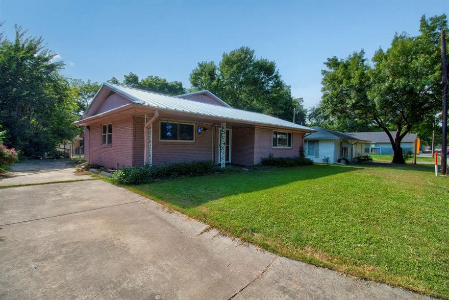 MOTIVATED SELLER!!  Newly painted, new floors, updated bathrooms and new metal roof!  Master bedroom with walk in closet with newly remodeled bathroom with a large walk in shower downstairs. The other 2 bedrooms with jack and jill bathroom are upstairs.  SS appliances in kitchen with ample cabinets and pantry. Garage conversion for office or flex room. Two storage buildings along the back fence and storm shelter in the large backyard.  Separate workshop behind the house has electricity to make a terrific workshop.  Charming gazebo that could house a firepit or lawn furniture for a peaceful, relaxing setting.  Come see me today and bring us an offer!