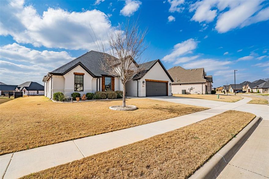 Stunning single story Couto Home in desirable Harbor Lakes subdivision. This luxurious 2,357 sq ft home features high-end finishes throughout, including extensive granite countertops, elegant coffered ceilings, and sophisticated design details. The open-concept layout boasts a gourmet kitchen with large island, premium appliances, abundant cabinetry, with seamless flow into the inviting living area with cozy gas fireplace. Three spacious bedrooms plus a dedicated office provide ample comfort, while the primary suite offers a spa-like ensuite bath with dual vanities, soaking tub, separate shower, and generous walk-in closet. Additional highlights include a well-appointed laundry room, thoughtful storage solutions, beautiful flooring, bright airy ambiance, and a Generac whole-home generator for peace of mind in the event of a power outage. Located in a premier gated community with golf course access and proximity to Granbury’s historic square, this exceptional home combines modern luxury with convenient Texas living. Schedule your private showing today!