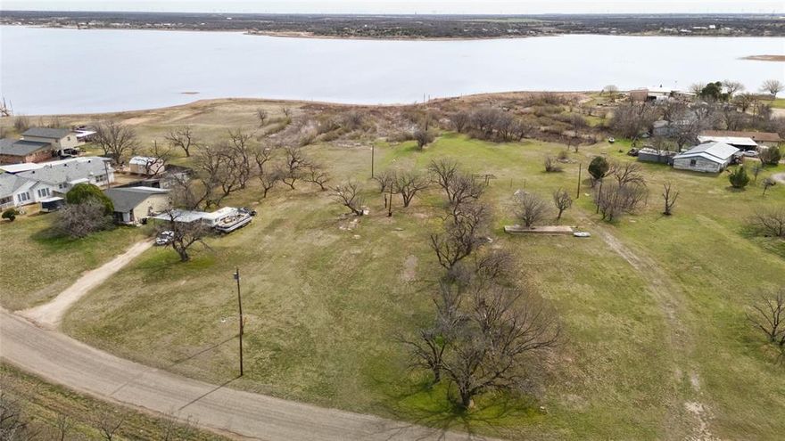 Prime lakefront lot on Lake Fort Phantom in Abilene, TX. Ready for your new home with city water and electricity available; a septic tank will be needed. Enjoy stunning views, peaceful surroundings, and outdoor activities. Enjoy the lake life to the fullest! Fort Phantom Hill Reservoir is currently at an impressive 84.6% capacity, with 59,237 acre-feet of conservation storage out of a total 70,030 acre-feet. The lake level is high right now, providing ample water for boating, fishing, and breathtaking views. Will allow modular homes, NO MANUFACTURED HOMES. Separate deed restrictions apply.