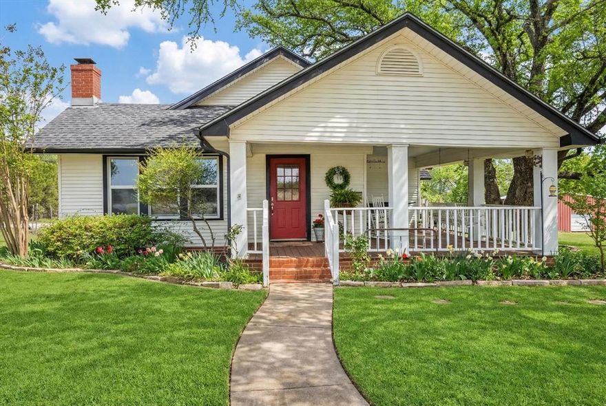 Nestled among 144 acres of stunning Texas land you’ll find a charming craftsman style home. This home was relocated to this land from its original location in downtown Ft. Worth. The traditional wrap around porch welcomes you into this 1920’s home. Inside you’ll find a living space with a fireplace and built-in shelving, an arched doorway leads into the dining room. The kitchen has been updated with granite, crisp white cabinetry, stainless steel appliances including a double oven and a breakfast bar. Off the kitchen you’ll find a cozy office space or a reading nook. The primary suite has incredible natural light, soaking tub, separate shower, dual sinks, coat and walk-in closet. Two additional bedrooms both with walk-in closets share a bathroom. The second primary suite with ensuite bathroom is perfect for guests, or as a mother-in-law suite. All rooms including bathrooms have ceiling fans. The laundry room is conveniently located by the back porch entry, with built-in cabinetry and a sink. Next to laundry is another closet that houses the water heater, an extra fridge and more storage. The property boasts a gorgeous pool perfect for Texas summers with plenty of space for lounge and table seating for relaxing and entertaining. This expansive property is covered in trees, has a pond and is perfect for hunting, horseback riding, camping and more. The barn offers 2 stalls, a goat or sheep stall, workshop space, tack room, storage room and more storage on the second floor. The well house has been upgraded with foam insulation and water system.