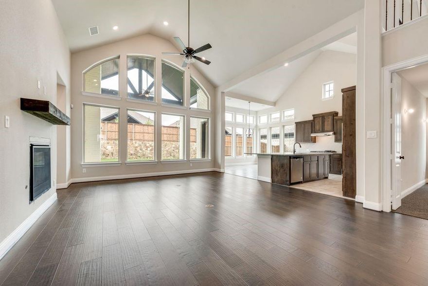 New Grand Home in Monterra - master plan neighborhood w swimming pool, splash pad, trails, park & pickleball courts! Sought after Rockwall ISD. Spacious home on north facing homesite just blocks to pool & pickleball. Open & bright 5 bedroom home has 5 large livings - open family room - Home Office or Den - downstairs Media Room - Gameroom & upstairs Bonus Room or Media for kids. Downstairs Guest Suite. Chef's kitchen has large island with granite slab tops, Shaker cabinets, full bowl sink, stainless steel appliances, 5 burner gas cooktop, & walk in pantry. Custom features include 8 foot doors, free standing tub in Primary Bath, frameless glass shower w tile, & large walk in closet. Upstairs Gameroom & Media Room or Playroom. Covered Back Patio with outdoor fireplace ready to entertain! Plush landscaping with stone edged flower beds. Convenient location w lots of shopping & dining options near Lake Ray Hubbard. Energy Star Partner w R38 & tankless water heater.