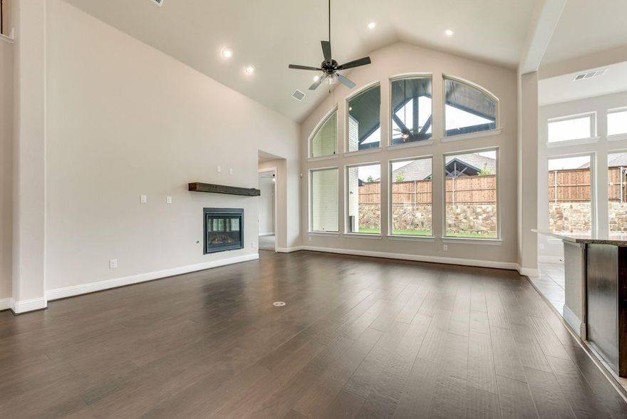 New Grand Home in Monterra - master plan neighborhood w swimming pool, splash pad, trails, park & pickleball courts! Sought after Rockwall ISD. Spacious home on north facing homesite just blocks to pool & pickleball. Open & bright 5 bedroom home has 5 large livings - open family room - Home Office or Den - downstairs Media Room - Gameroom & upstairs Bonus Room or Media for kids. Downstairs Guest Suite. Chef's kitchen has large island with granite slab tops, Shaker cabinets, full bowl sink, stainless steel appliances, 5 burner gas cooktop, & walk in pantry. Custom features include 8 foot doors, free standing tub in Primary Bath, frameless glass shower w tile, & large walk in closet. Upstairs Gameroom & Media Room or Playroom. Covered Back Patio with outdoor fireplace ready to entertain! Plush landscaping with stone edged flower beds. Convenient location w lots of shopping & dining options near Lake Ray Hubbard. Energy Star Partner w R38 & tankless water heater.