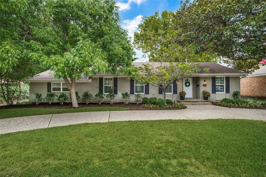 Located in coveted Lakewood Elementary, this home features a spacious open floor plan with stunning updates. The completely remodeled kitchen is not only beautiful but functional with silestone countertops, 5-burner gas range with griddle, stainless farm sink, custom cabinetry, ample storage and generous pantry. Gas fireplace with tile focal wall and wood mantle accents the living room. Spacious master with beautifully remodeled en-suite bath complete with dual sinks and walk in shower. Large secondary bedroom + office with built-ins and hand scraped hardwoods throughout. Fenced backyard with patio, electric driveway gate and attached oversized garage with EV charging. Additional updates include recessed lighting, double-pane windows, updated electrical and HVAC, tankless hot water heater, smart locks, new garage door and so much more. Minutes from White Rock Lake with easy access to everything East Dallas has to offer. --