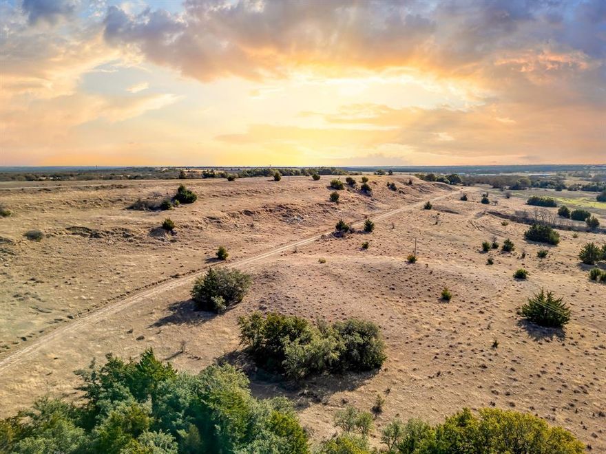 Set along County Road 2475 in Alvord, Texas, this remarkable 160-acre tract offers a rare opportunity to own a commanding piece of North Texas countryside with truly million-dollar views. The property features gently rolling terrain that rises to a prominent hilltop, where sweeping, unobstructed vistas stretch across several counties including the protected expanse of the Lyndon B. Johnson National Grasslands.

From the high point, the land unfolds in every direction—wide open skies, layered horizons, and seasonal colors that create a constantly changing landscape. The elevation provides both privacy and perspective, making it an ideal location for a luxury ranch estate, dream home, or long-term investment property.

The acreage is well-suited for a variety of uses, including recreational enjoyment, cattle grazing, or a legacy family retreat. With paved county road frontage and the natural beauty of the surrounding grasslands ensuring lasting views and serenity, this property offers a balance of accessibility and seclusion that is increasingly hard to find.

Whether envisioned as a private hilltop residence or a generational land holding, this 160-acre offering stands out for its scale, elevation, and breathtaking outlook over one of Texas’s most scenic preserved landscapes.
