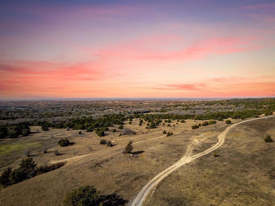 Set along County Road 2475 in Alvord, Texas, this remarkable 160-acre tract offers a rare opportunity to own a commanding piece of North Texas countryside with truly million-dollar views. The property features gently rolling terrain that rises to a prominent hilltop, where sweeping, unobstructed vistas stretch across several counties including the protected expanse of the Lyndon B. Johnson National Grasslands.

From the high point, the land unfolds in every direction—wide open skies, layered horizons, and seasonal colors that create a constantly changing landscape. The elevation provides both privacy and perspective, making it an ideal location for a luxury ranch estate, dream home, or long-term investment property.

The acreage is well-suited for a variety of uses, including recreational enjoyment, cattle grazing, or a legacy family retreat. With paved county road frontage and the natural beauty of the surrounding grasslands ensuring lasting views and serenity, this property offers a balance of accessibility and seclusion that is increasingly hard to find.

Whether envisioned as a private hilltop residence or a generational land holding, this 160-acre offering stands out for its scale, elevation, and breathtaking outlook over one of Texas’s most scenic preserved landscapes.