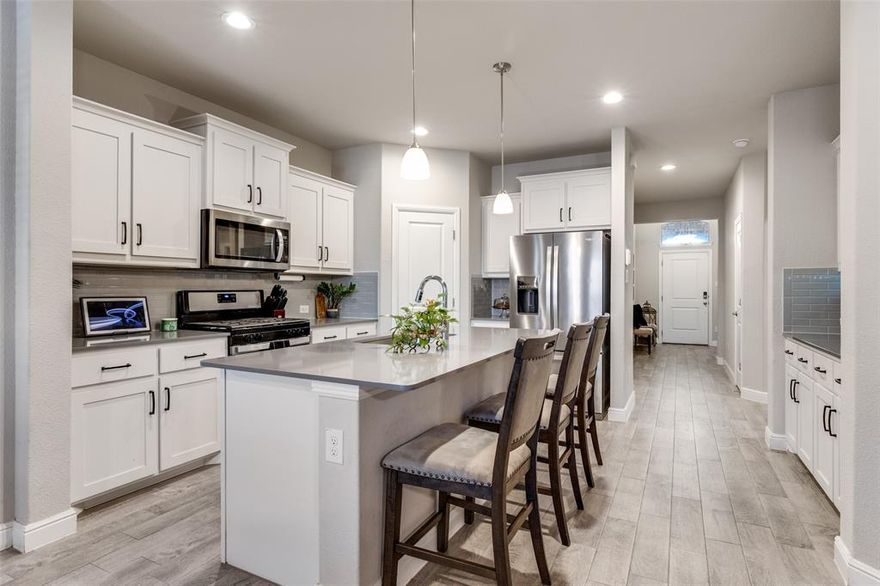 Welcome to this stunning 4-bedroom, 2-bathroom home nestled in a vibrant community! Move in ready home offers quartz countertops and split bedrooms for optimal privacy, this home has an open concept floorplan. Step outside onto the oversized covered patio, perfect for enjoying the serene outdoors. But the amenities don't stop there - this community offers an array of delights, including a relaxing pool with a lazy river, inviting lounge areas, and a clubhouse for gatherings, playgrounds, trails, and much more! With outdoor eating areas and convenient access to the highway, this home truly offers it all. Call today for a private tour!