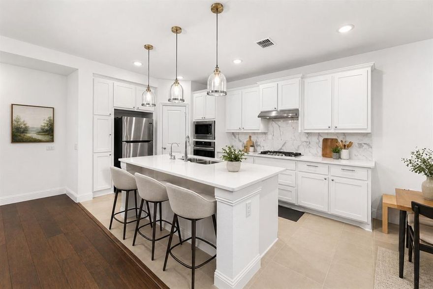 Immaculately maintained and thoughtfully designed, this exceptional residence was built by Highland Homes and is nestled within the highly desirable master-planned community of Trinity Falls. Bathed in natural light and adorned with warm, sophisticated finishes, the home offers a refined yet inviting living experience. The open-concept layout is both elegant and functional, with a seamless flow from the spacious living area to a gourmet kitchen featuring stainless steel appliances, a large island, and abundant storage, perfect for hosting and entertaining. On the main level, you’ll find a luxurious primary suite, a private home office, and an additional bedroom for guests or multi-generational living. Upstairs, two more bedrooms surround a versatile game room, perfect as a media lounge or additional living space. Step outside to your private backyard retreat, a serene setting for relaxation or entertaining. Located in Trinity Falls, residents enjoy resort style amenities, scenic trails, and a prime location just a short distance to Ruth and Harold Frazier Elementary School. Don’t miss this rare opportunity to own a Highland Homes gem in a premier community.