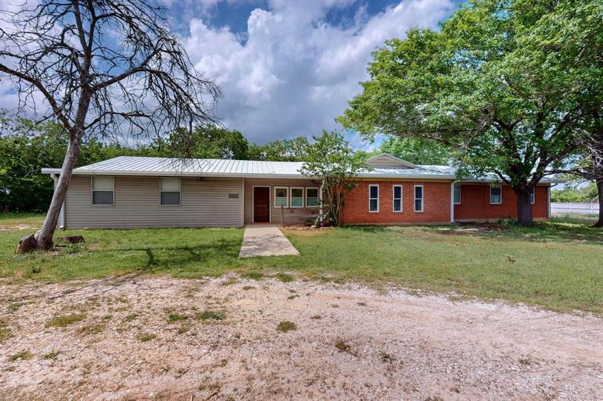 Room to Breathe, Close to Everything. Set on nearly an acre just minutes from I-35, this spacious 4-bedroom, 2-bath ranch-style home gives you the best of both worlds—peace and privacy with easy access to Burleson, Cleburne, and Fort Worth. Inside, the kitchen opens to two dining areas—a casual breakfast space and a formal dining room—making it easy to host family dinners or lazy Sunday brunches. Stainless steel appliances and a generous breakfast bar offer plenty of room to cook and gather. Saltillo tile adds warmth and character to the main living spaces and primary suite, while the additional bedrooms and dining room feature durable laminate flooring. Step outside to a large deck overlooking a private backyard that backs to open land—ideal for relaxing, entertaining, or simply enjoying the quiet. With its inviting layout and country feel, this home is ready for your personal touch. Come see why life feels a little slower—and sweeter—here.