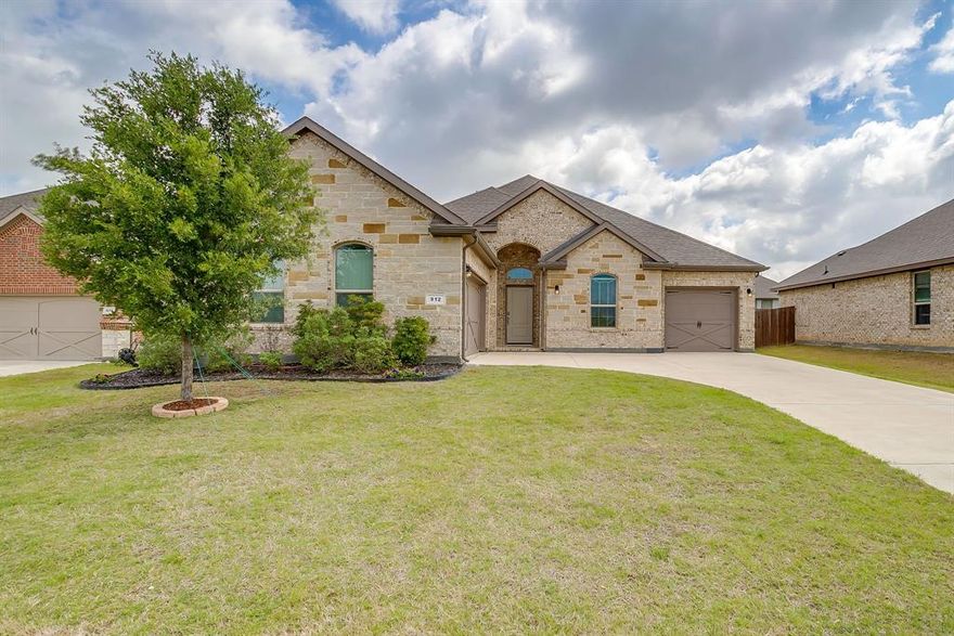 Beautifully maintained 4-bedroom, 2-bath home offering 2,270 sq ft of stylish living space, and located in highly regarded Mansfield ISD. Situated across from a peaceful greenbelt, this home combines modern style with every day comfort. Inside, you’ll find an open and inviting floor plan designed for both everyday living and entertaining. Tile flooring extends throughout the main living areas, while the bedrooms feature new carpet for a fresh and cozy feel. The flexible fourth bedroom can easily be used as a home office, playroom, or guest room. The spacious kitchen is a standout feature with granite countertops, tiled backsplash, gas cooktop, stainless steel appliances, a large center island, and abundant cabinet space. Privately located at the rear of the home, the primary suite offers a relaxing escape with double vanities, quartz countertops, a separate shower, and a garden tub. The separate 3-car garage features epoxy floors and includes a mounted high-pressure compressor that conveys with the property. Outside, enjoy a generously sized backyard with a 6-foot privacy fence and a large covered patio—perfect for outdoor gatherings. Complete with smart home technology, this move-in-ready home offers the perfect blend of space, upgrades, and a great location.