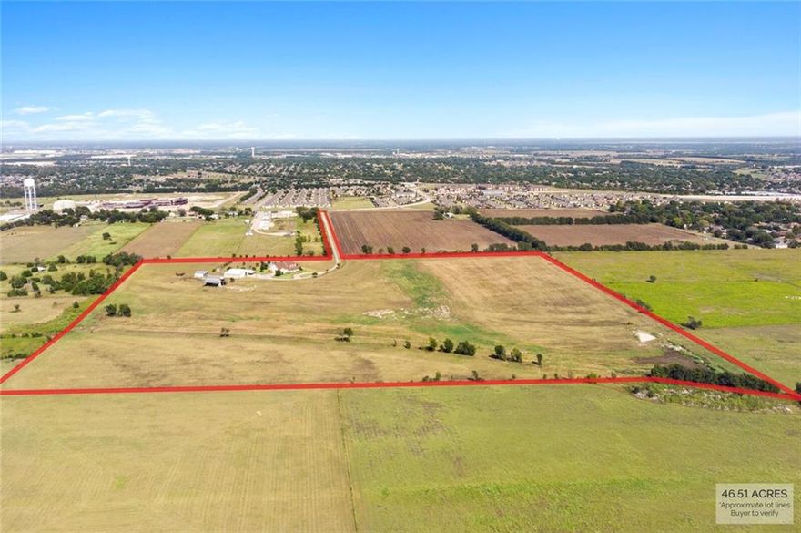 Your picture-perfect Texan ranch awaits in this stunning Midway ISD property that exudes class and elegance. A long driveway and a grand front porch provide the perfect welcome, setting the tone for this exceptional property anyone will be proud to call their own.

There is a guest house and the main residence with a total of five bedrooms and 5.5 bathrooms, plus multiple living spaces to ensure a room for every mood and occasion. The main home features three decadent bedroom suites and 3.5 bathrooms including a luxurious master suite, while the guest house offers two bedrooms, two bathrooms and a game room with a full bath.

The heart of the layout is the chef’s kitchen with views over the family room that is warmed by a fireplace. There is a casual dining nook as well as a formal dining room illuminated by a glittering chandelier. High ceilings soar overhead and there are recessed lights for a modern feel and gorgeous hand-scraped hardwood floors underfoot.

The movie lover will adore the custom theater room with a 4k projector and 12 ft screen paired with surround sound, theater seating and soundproof walls for an authentic cinematic experience. There is also a wet bar with a wine cooler and ice maker to ensure guests can enjoy the screening in complete comfort.

On sunny days, you can relax in the screened-in porch with motorized shades and take in views over the land with 30 live oak trees, each with individual irrigation, and iron pipe fencing. The spa, pool and waterfall feature are ready for hot summer days and there is also a fire pit for cool fall afternoons.

For those with farming aspirations, there is a 2,400 sqft shop and a 50x60 barn with an observation deck, plus cattle pens and a cattle chute on this 46 acre piece of land. The long list of extra features includes a detached 3-car garage and an attached 2.5-car garage with space for a golf cart. There is also a central vacuum system, an exercise room with an infrared sauna, a 9-camera secur