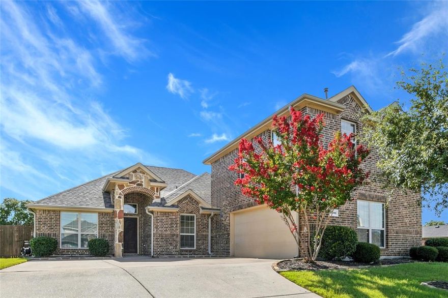 You won't believe the PRICE REDUCTION on this beautifully maintained 4-bedroom, 2-bathroom home nestled on a spacious corner lot in the highly sought-after Caruth Lakes community. With over 2,600 square feet, this versatile 1.5-story floor plan features all bedrooms on the main level, with a large upstairs bonus room that can serve as a fifth bedroom or game room. Inside, enjoy wood floors throughout the downstairs living spaces, tile in the kitchen and breakfast nook, and a chef’s kitchen equipped with granite countertops, stainless steel appliances, gas range, and an oversized island with breakfast bar seating. The spacious primary suite offers a relaxing retreat with a garden tub, separate shower with body sprays, dual vanities, and a walk-in closet. Step outside to a private backyard oasis with a large, covered patio and extended open patio—perfect for entertaining. The home backs to John King Boulevard with no rear neighbor and features a gated pet run, a newer roof, and upgraded fencing for added privacy. Enjoy community amenities just moments away, including a lake, walking trails, pool, splash park, and playground. Located in Rockwall ISD, with close proximity to schools, shopping, and dining—this home is a must-see! Also available for lease on MLS 21105984. The Sellers are open to working a lease to own option with the right background.