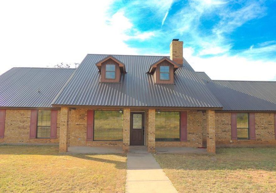 The stars shine bright deep in the heart of Texas at this charming country home located just outside the city limits, offering sweeping views in every direction. With so much space, versatility, and potential, this property delivers the peaceful lifestyle you’ve been dreaming of. Inside, you’ll find 3 nicely sized bedrooms, a large downstairs living area featuring a classic brick wood-burning fireplace, and a well-designed kitchen with excellent storage, quartz countertops, a breakfast bar, and an attached dining area. The large upstairs second living area makes the perfect game room, media room, or even a 4th bedroom—the choice is yours. Step outside to enjoy a front patio with impressive “mountain” views and a back porch and patio overlooking the premium metal-fenced backyard. The property also includes a large barn with extra parking and a spacious enclosed garage, giving you plenty of room for equipment, hobbies, or storage. This is the Texas country retreat you’ve always imagined—space, scenery, and serenity all in one place.