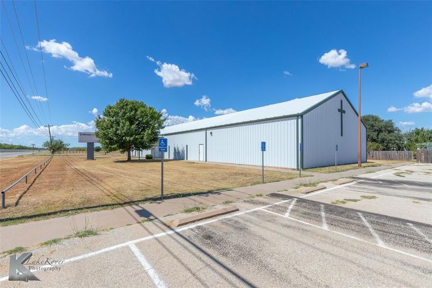 This versatile 8,000 SF building sits on 1.8 acres zoned GC (General Commercial District), offering a wide range of potential uses for investors, owner-occupants, or developers. Located in a high-growth area of West Abilene, the property is currently utilized as Broadview Baptist West Church and is well-suited for continued religious use or repurposing into office, educational, community, or event space.

Originally constructed in 2006 with additions in 2010 and 2018, the structure is a mix of steel and wood framing with a durable metal panel exterior and roof system. The foundation includes both reinforced concrete slab and pier-and-beam construction, supporting a range of interior layouts.

The spacious 4,200 SF sanctuary features tall vaulted ceilings, a raised platform, and acoustical ceiling grid with a mix of recessed and fluorescent lighting. Additional interior features include a foyer, one large fellowship hall (divisible into three classrooms), three dedicated classrooms, two nursery rooms with a shared restroom, a full kitchen, men's and women’s restrooms, and multiple storage-mechanical rooms. Flooring consists of commercial-grade carpet and vinyl, with textured and painted concrete block or gypsum walls throughout.

Site improvements include an asphalt paved parking lot with 49 striped spaces (4 ADA), concrete sidewalks, minimal landscaping, and existing monument signage. The property is not located in a flood zone, offering added peace of mind and reduced risk.

This is a unique chance to acquire a well-maintained, flexible-use facility in a growing commercial corridor of Abilene.